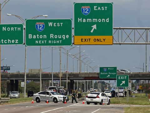 Baton Rouge police block Airline Highway after police were shot in Baton Rouge, La., Sunday, July 17, 2016.
